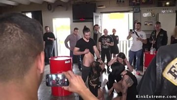 Brunette serves bikers in store