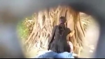 Covert web cam paramours smooching in park vid